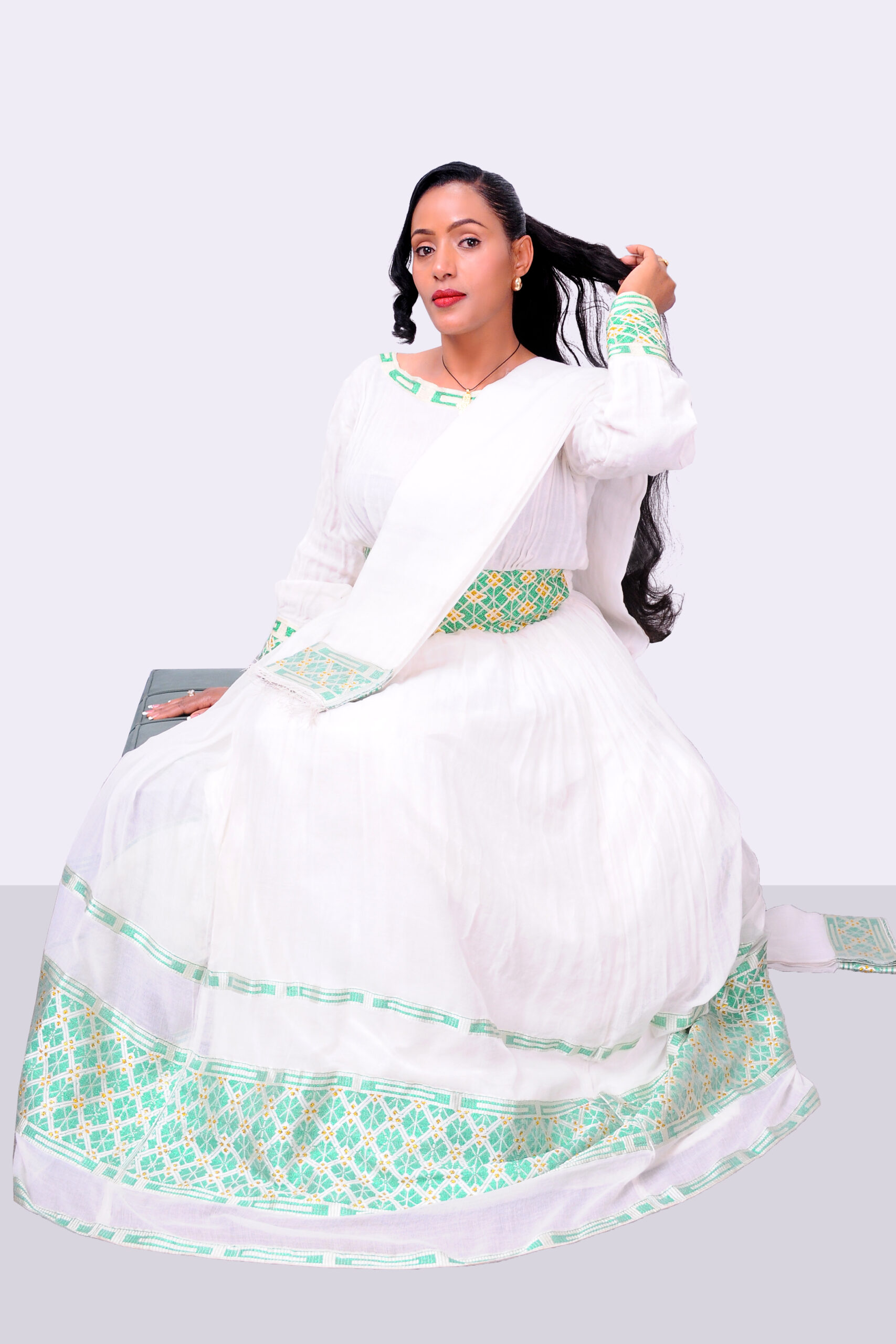 Elegant Habesha Dress with Rich Green Embroidery and Contemporary Charm