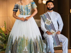 Vibrant Blue Habesha Couple's Attire with Intricate Detailed Design