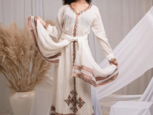 Effortless Elegance: Classic Habesha Kemis with Refined Red Detailing