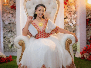 Modern Habesha Wedding Dress: Glowing in Radiant Red and Golden Embroidery