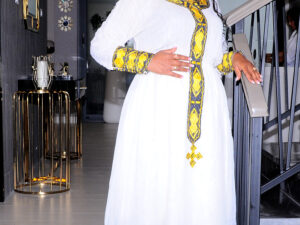 Elegant Habesha Dress with Rich Golden Embroidery for Events and Celebrations